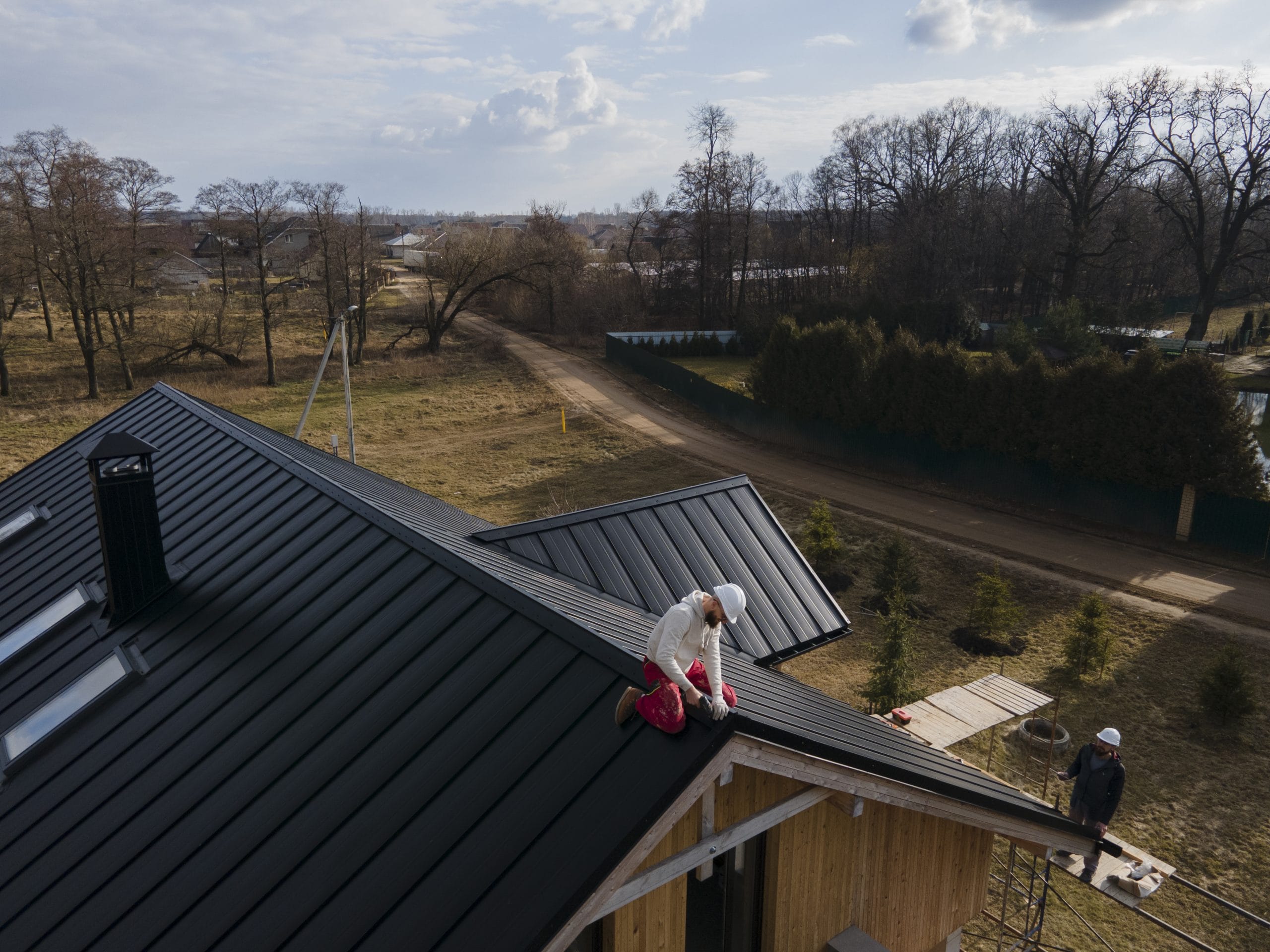 Copper Roofer installing metal roof on residential home